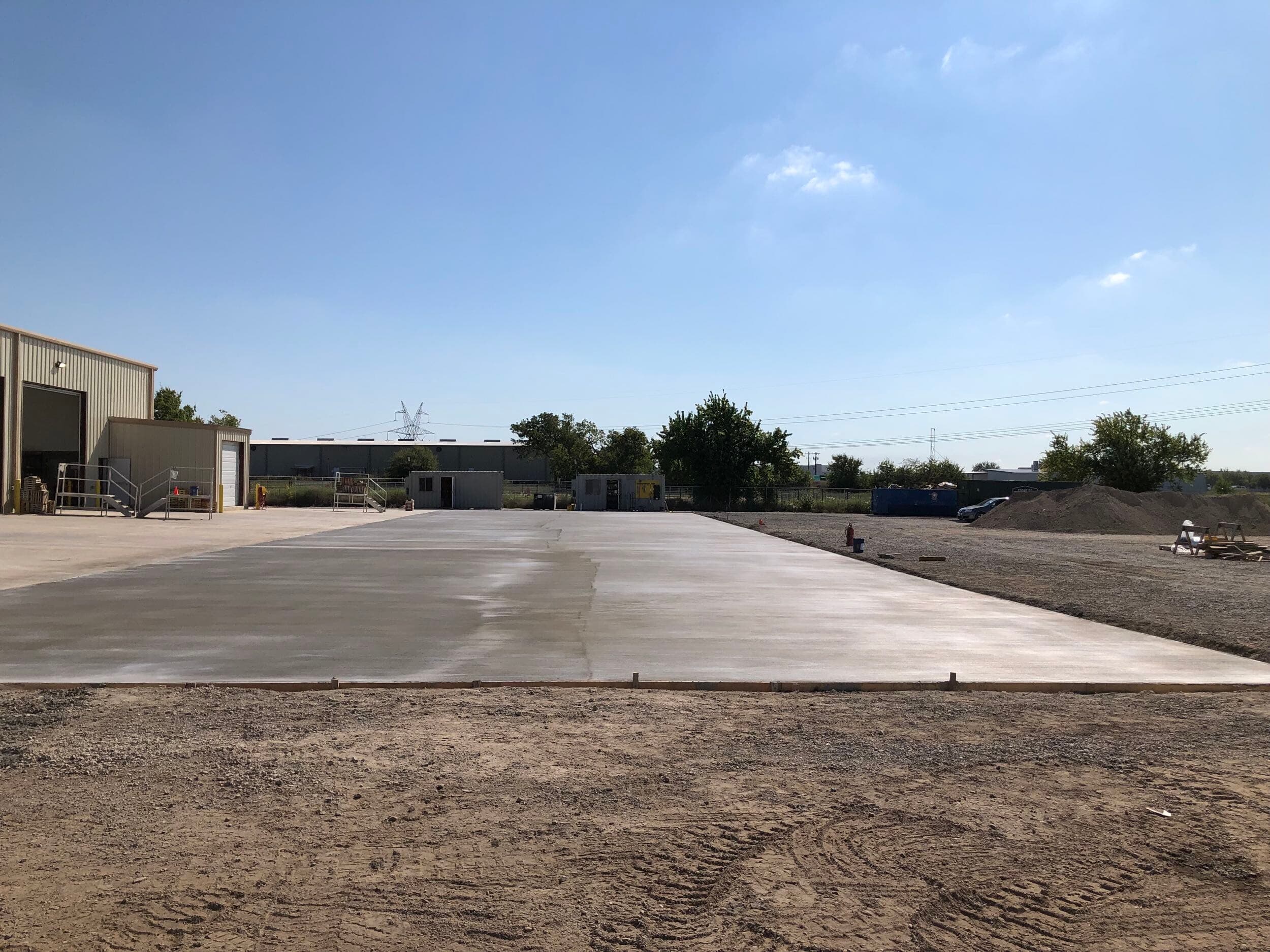 Satellite Shelters — 12,000 sq ft new building — service bays, technician facilities, 18,400 sq ft concrete